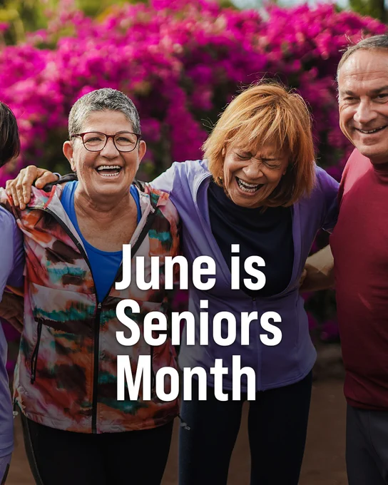 A group of people smiling and standing close together outdoors. Text says "June is Seniors Month."