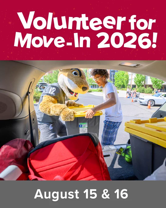 Promotional graphic with large white text on a red background reading “Volunteer for Move-In 2026!” Above a photo taken from inside an open car trunk, where a university mascot and a person load yellow-lidded storage bins during a campus move-in scene. Other people, cars, and trees are visible in the background. A gray banner at the bottom reads “August 15 & 16.”