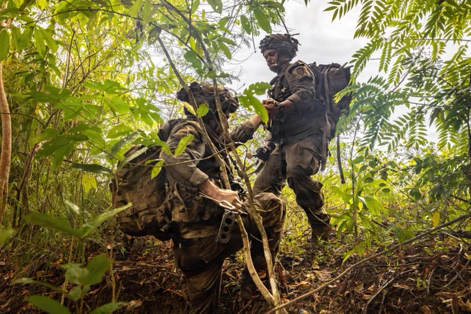 U.S. Soldiers assigned to 2nd Battalion, 35th Infantry Regiment, 3rd Mobile Brigade Combat Team, 25th Infantry Division maneuver through the jungle to clear an objective of opposing forces during the Joint Pacific Multinational Readiness Center Exportable Exercise at Fort Magsaysay, Nueva Ecija, Philippines, May 19, 2026.