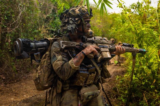 U.S. Army Sgt. Ford Silas, assigned to 2nd Battalion, 35th Infantry Regiment, 3rd Mobile Brigade Combat Team, 25th Infantry Division, alongside Philippine Army soldiers assigned to 91st Brigade Reconnaissance Company, 1st Brigade Combat Team, maneuver through the jungle to clear an objective of opposing forces during the Joint Pacific Multinational Readiness Center Exportable Exercise at Fort Magsaysay, Nueva Ecija, Philippines, May 19, 2026.