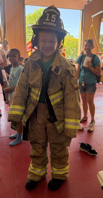 boy in fire fighting clothes 