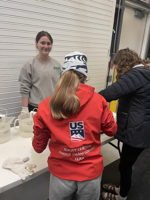 Students measuring larval sea lampreys during a laboratory tour. Photo credit: GLFC.