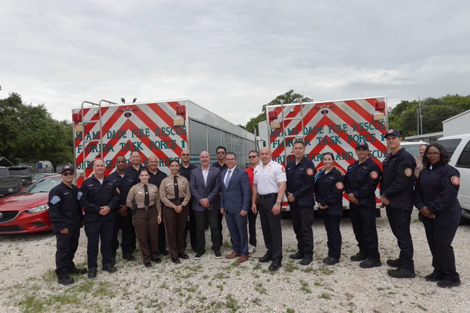 Miami-Dade Fire Rescue Chief Ray Jadallah poses with members of Florida Task Force 1.