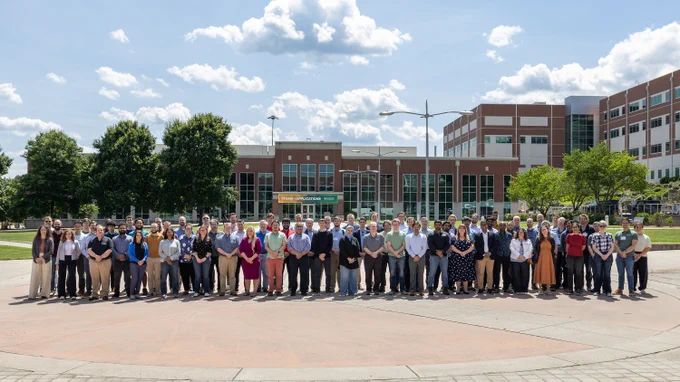 Participants in the 2026 Oak Ridge Leadership Computing Facility User Summit outdoors for a group photograph at Oak Ridge National Laboratory.