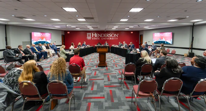The Arkansas State University System Board of Trustees gathered in the Banquet Room in the Garrison Center at Henderson State University. 
