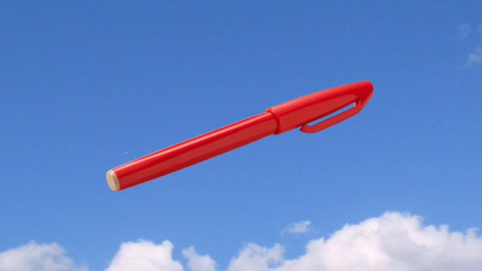 Image of a red pen floating in the air. 