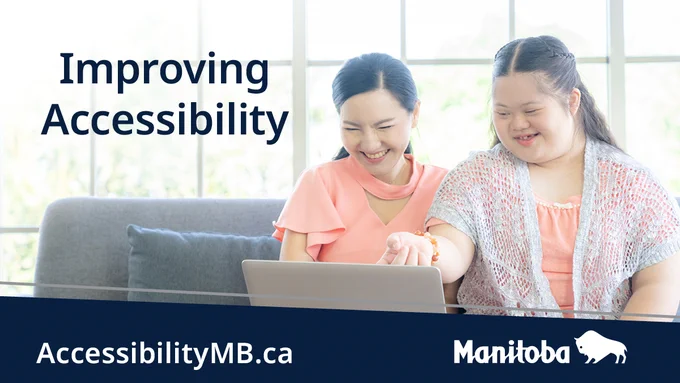 Image of two individuals reviewing something on laptop screen. Caption: Improving Accessibility. Accessibilitymb.ca.