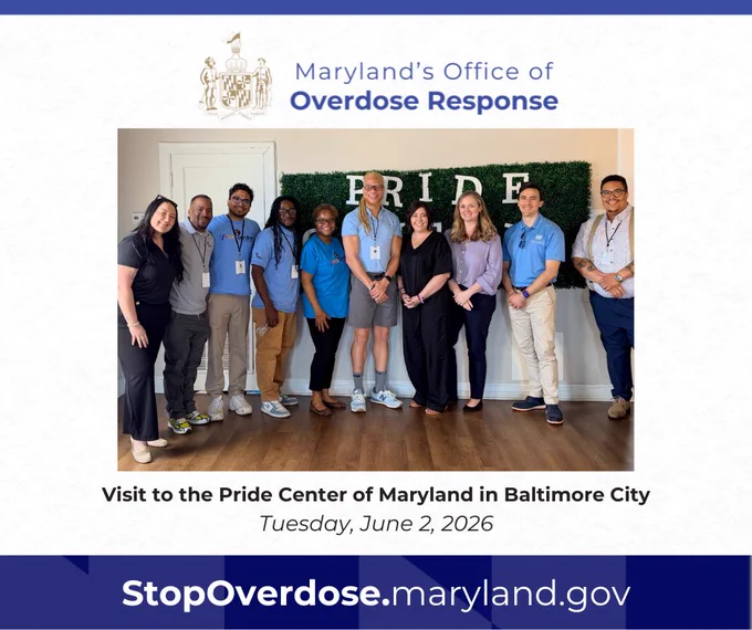 A group of ten people, including Maryland Special Secretary of Overdose Response Emily Keller, standing and smiling for a picture in front of a green hedge wall that reads "PRIDE." Text surrounding the picture reads: "Visit to the Pride Center of Maryland in Baltimore City. Tuesday, June 2, 2026. StopOverdose.maryland.gov." 