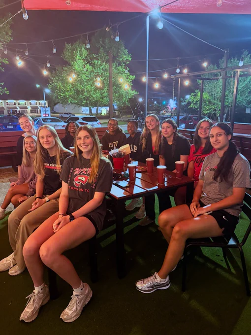 WKU women’s basketball team at outdoor dining table