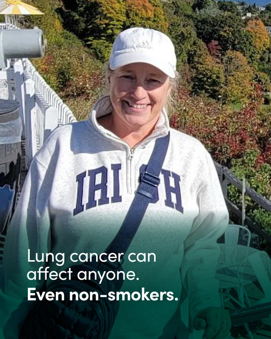A person wearing a white cap and an "IRISH" sweatshirt is outdoors on a walkway with autumn trees in the background. The image includes the text "Lung cancer can affect anyone. Even non-smokers.