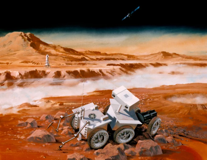 A futuristic rover with six wheels navigates a rocky, reddish Martian landscape. In the background, a rocket stands tall on the horizon, while a small spacecraft orbits above in the dark sky. Dust clouds drift across the terrain.