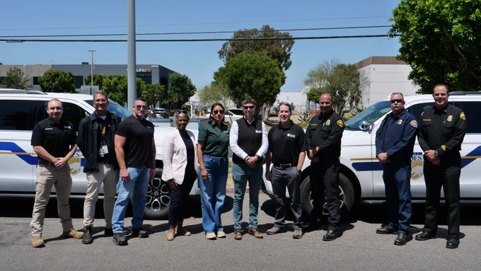 The photo shows a group photo of Cal OES, Cal EPA, and Orange County Fire Authority representatives