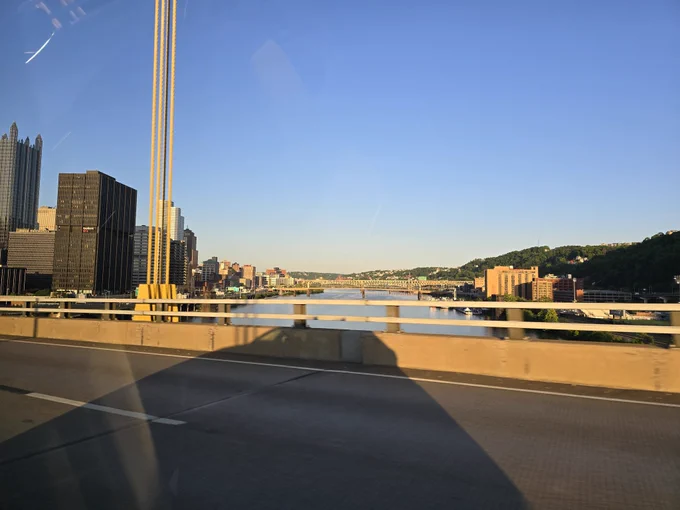 Shot of river and bridges taken while driving over a bridge 