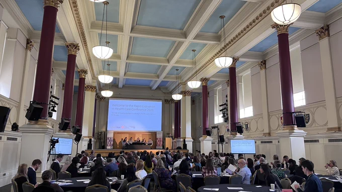 Photo from the back of the room during the plenary session at the Rapid Evaluation Conference.