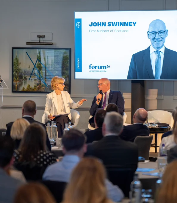 First Minister John Swinney speaking to Sally Magnusson during a question and answer session with audience members at the Prosper Forum.