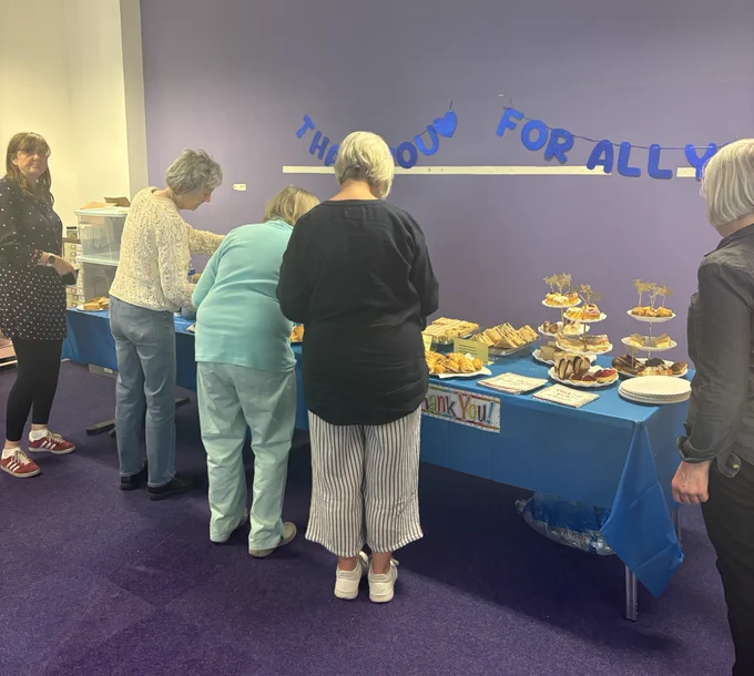 Volunteers at the Volunteers Week tea party enjoying the buffet