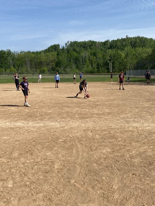 6th graders out in the field ready to chase after the kick ball