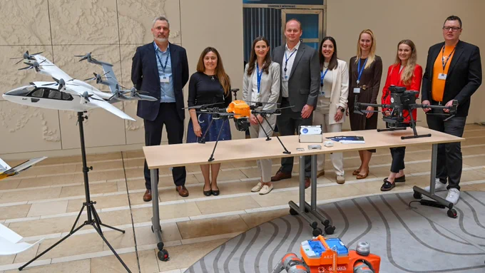 Zuri hybrid-electric tiltrotor aircraft model on display with project participants at the EUSPA EU Space Programme event in Prague.