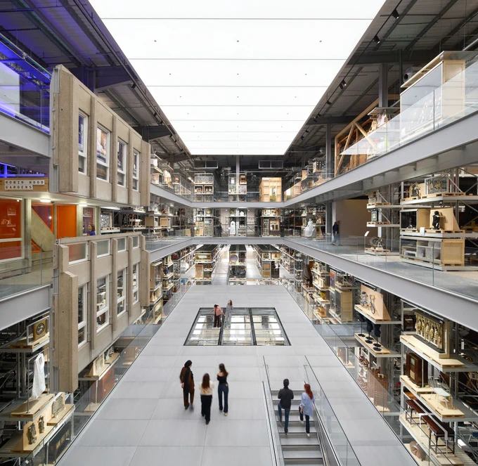 The Weston Collections Hall at V&A East Storehouse, including over 100 mini curated displays ‘hacked’ into the ends and sides of the storage racking. The space is anchored by six large-scale objects, including a building section from the now-demolished Robin Hood Gardens, a former residential estate in Poplar, east London. Photo by Hufton   Crow. Courtesy V&A