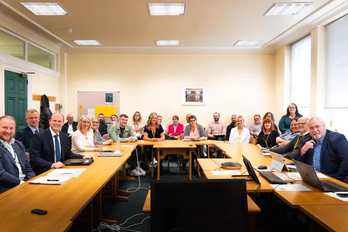 A group photo with Minister Lyons and the All-Party Group on Homelessness.