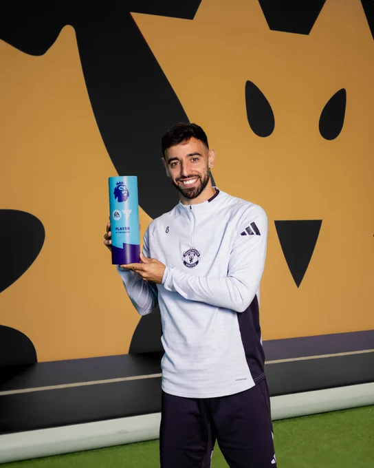 Bruno Fernandes poses with his Premier League Player of the Season award.