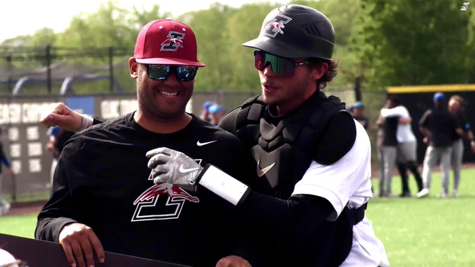 Coach Devarie & Chase Mason embrace.