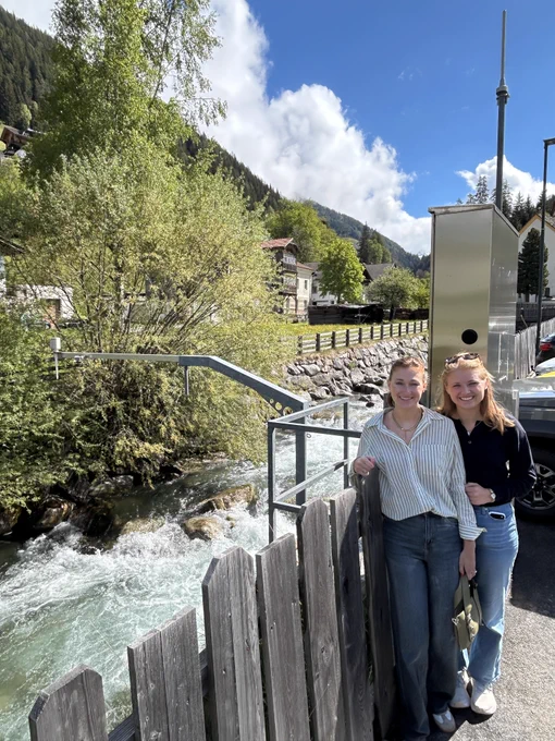 UA Water-R20 NRT trainee Jules Webb and master's student Maggie Duncan stand at the St. Jodok streamflow gauge in Austria during their paleoclimate drought research fieldwork with the University of Innsbruck.