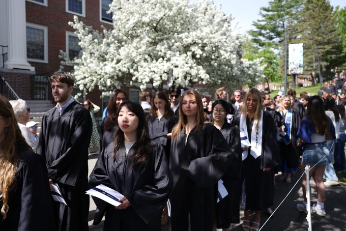 a group of people standing in front of a crowd