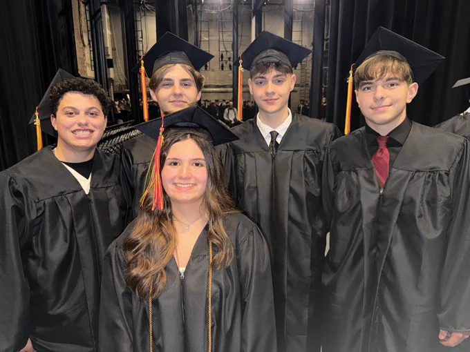 Photo of graduates in caps and gowns