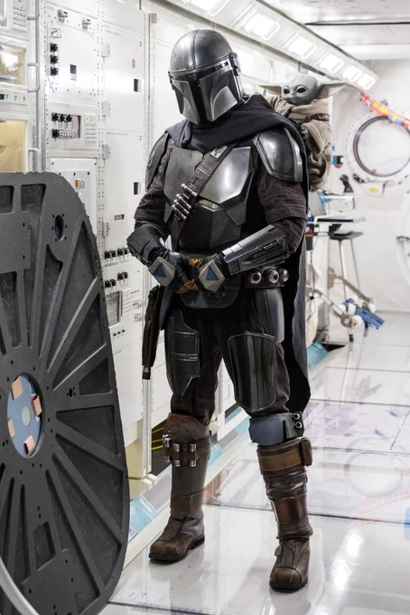 The Mandalorian and Grogu stand inside the International Space Station mockup at the Space Vehicle Mockup Facility at NASA’s Johnson Space Center in Houston, TX. Credit: NASA/James Blair