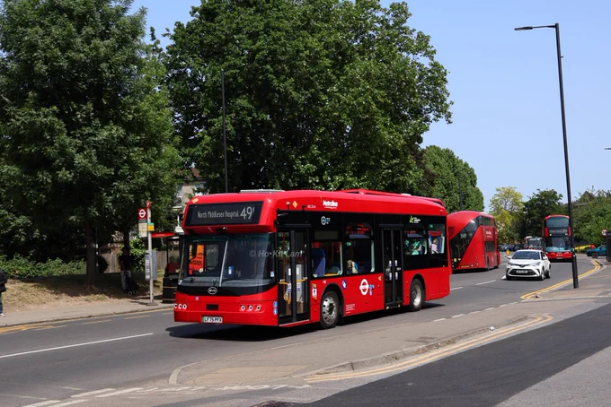 Metroline BEL3241 (LF75PFX) is a red BYD B12 and is pictured in Edmonton Green, Hertford Road as it headed to North Middlesex Hospital on route 491.