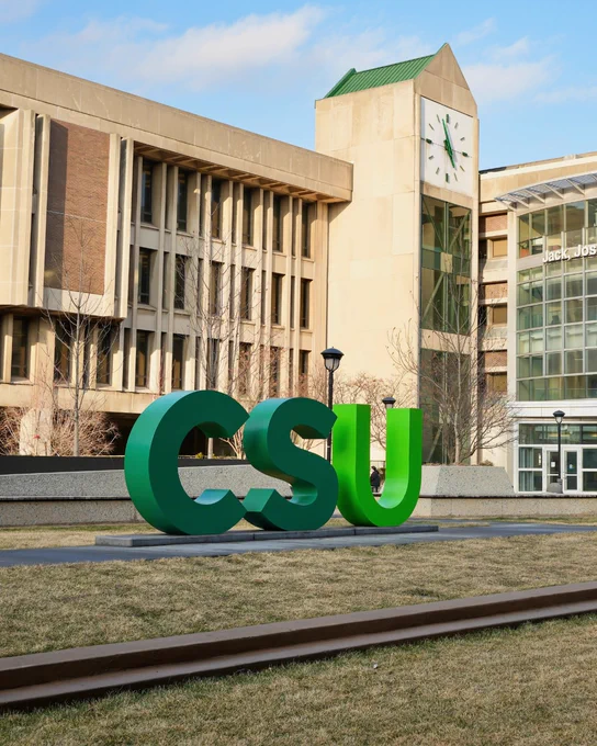 The McCombs Plaza on the Cleveland State University campus with the CSU letter display and a building in the background. 
