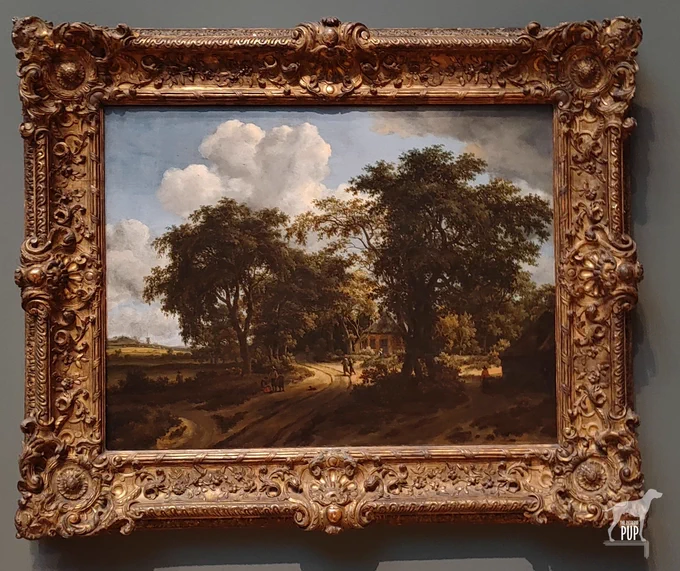Landscape painting with threes against a blue sky with puffy clouds. A dirt road snakes through the scene past a woodland cottage. There are people and a dog traveling on the road.