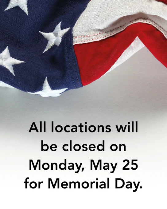 Close-up of an American flag with text overlay announcing that the San Antonio Public Library will be closed on Memorial Day