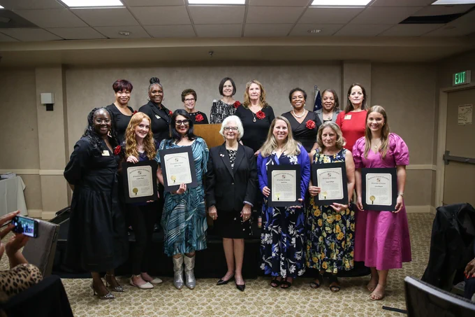 Photo of County Executive Klausmeier with award recipients and attendees at the award ceremony.