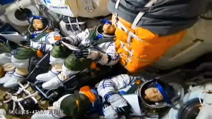 Chinese taikonauts Zhu Yangzhu, Zhang Zhiyuan and Lai Ka-ying are seen on board the Shenzhou 23 spacecraft prior to their May 24, 2026 launch from the Jiuquan Satellite Launch Center. (CCTV)