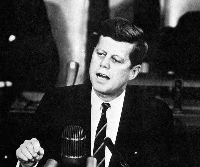 Black and white photograph taken on May 24, 1961 of President John F. Kennedy speaking in front of a joint session of Congress.
