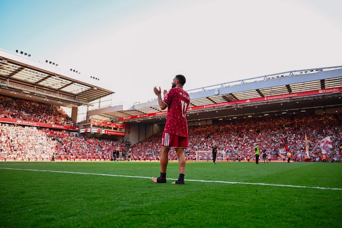 Photography of Mo Salah as he applauds Anfield.