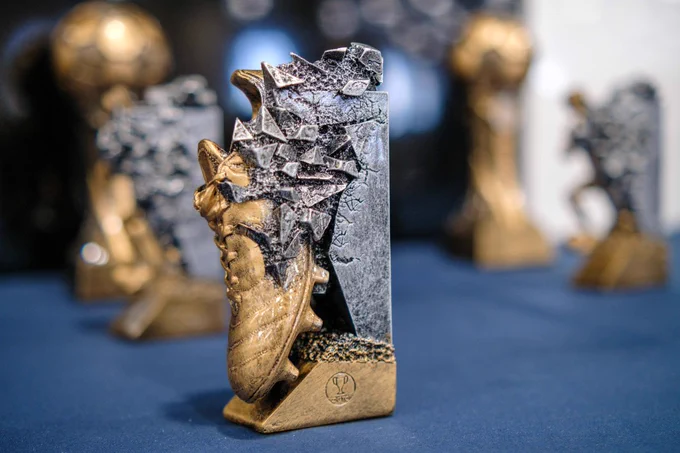 Close-up of individual award trophy with other trophy blurred out in the background.