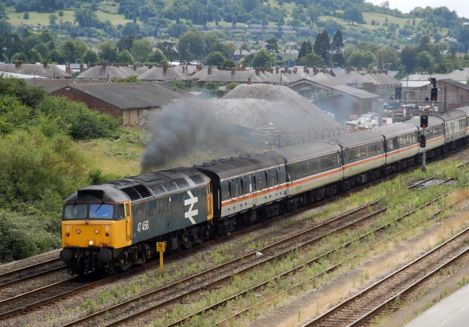 Large logo liveried locomotive 47456 passing Gloucester.