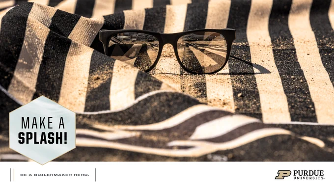 A pair of sunglasses sits on a black and gold striped towel. The text "Make a Splash!" is displayed prominently. Purdue University's logo is visible in the lower right corner.