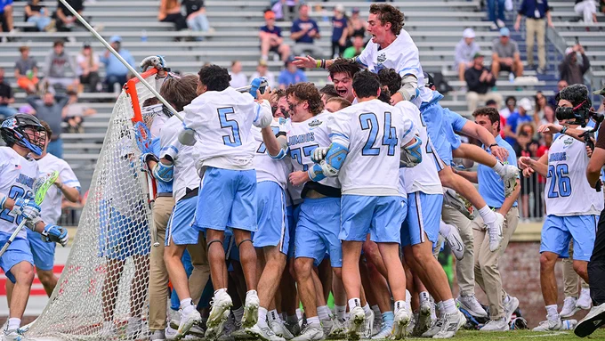 The Tufts men's lacrosse teams jumps in a pile following their victory in the NCAA National Championship following their victory on May 24, 2026. Photo: Stephen Blue/Sideline Media