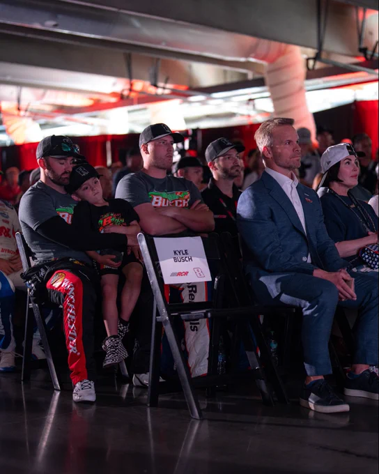 An empty seat for Kyle Busch during the driver's meeting at Charlotte.