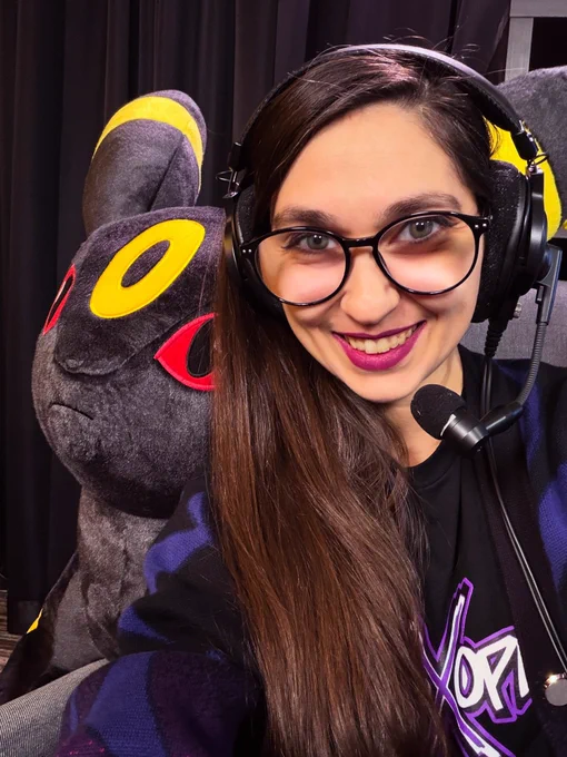 Diva at RPGLIMITBREAK posing with a giant Umbreon