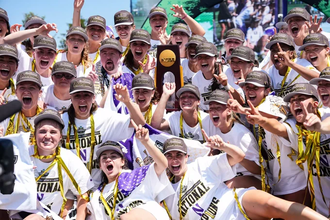 Northwestern Lacrosse holds the NCAA Championship trophy. 