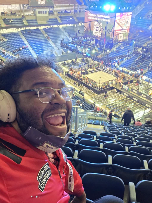 Me taking a selfie with a wrestling ring in the background 