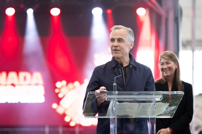 Prime Minister Mark Carney stands behind a podium during a ‘Canada Celebrates’ FIFA World Cup 26™ event in Ottawa. 
