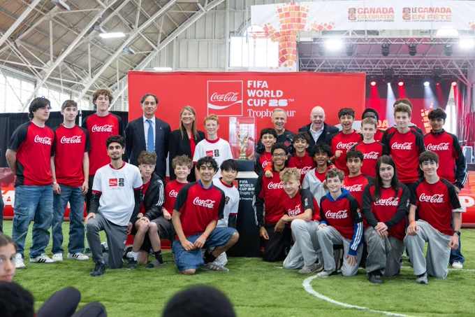 Prime Minister Mark Carney poses with a local soccer team during a ‘Canada Celebrates’ FIFA World Cup 26™ event in Ottawa. 