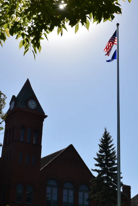 American Flag with VCSU clocktower behind