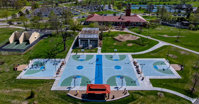 The sport courts, Dennis & Judith Jones Variety Wonderland Playground and Parking Lots surround the Visitor Center in Forest Park 